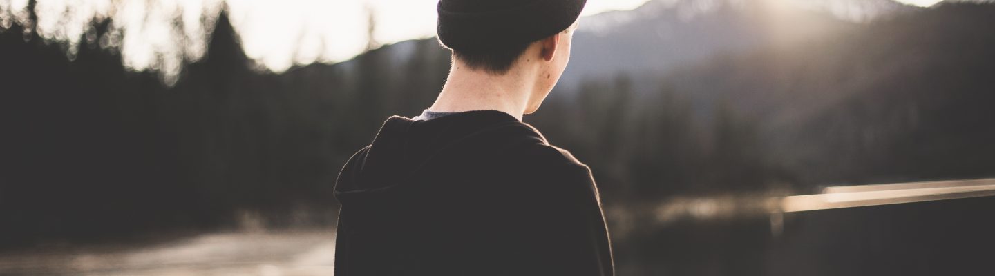 Teen boy staring into distance